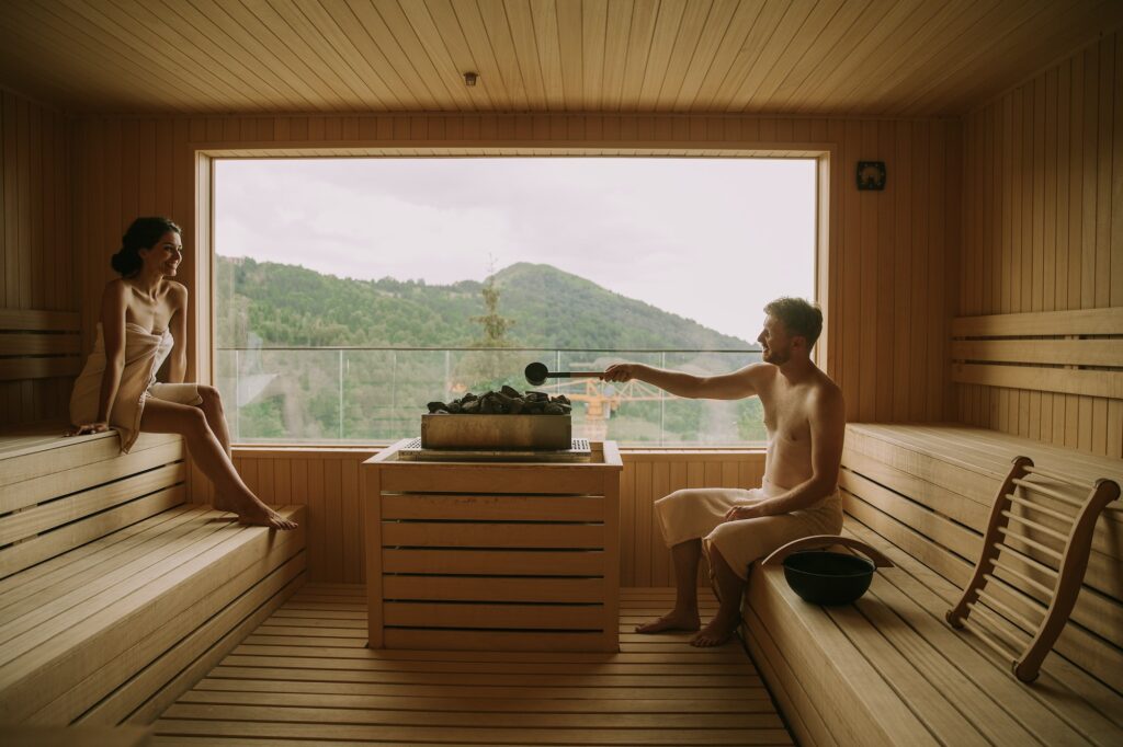 Young couple relaxing in the sauna